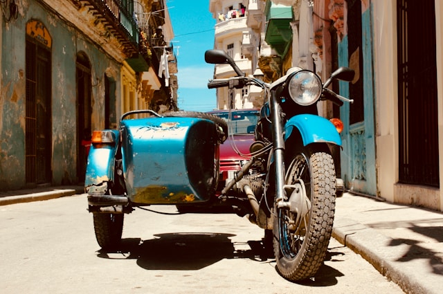 A photo of a motorbike with a sidecar.